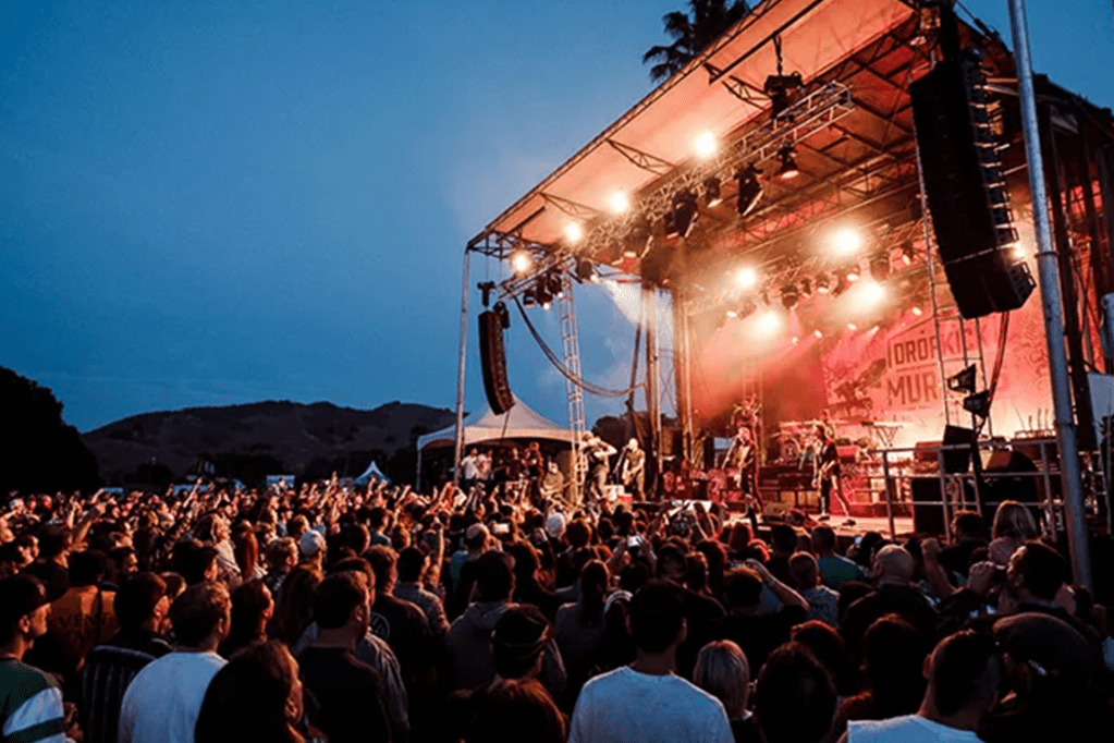 Festival stage with dancing guests